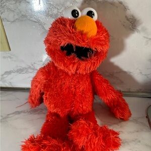 Sesame Street Red Stuffed Animal with Fuzzy Texture and Smiling Face